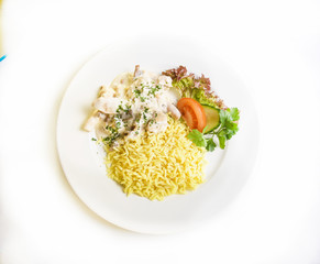 liver in sour cream sauce with rice and vegetables
