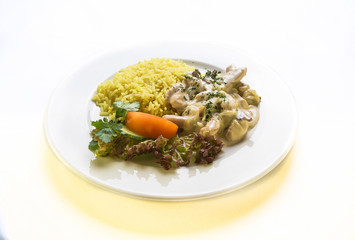 liver in sour cream sauce with rice and vegetables