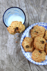 milk glass with oat cookies with raisin