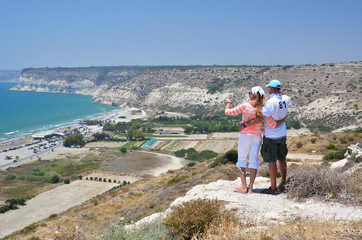 A couple looking to the coastline of Cyprus