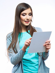 Teenager girl hold white blank paper. Young smiling woman show