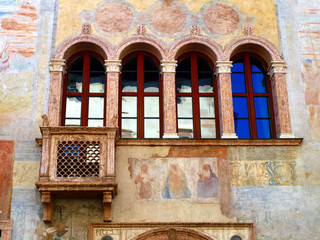 detail of the facade of the old building decorated in Trento in