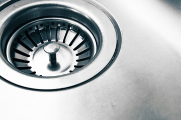 a stainless steel kitchen sink drain