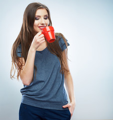  Coffee cup. Young woman on isolated studio background drink co
