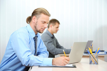 Office staff is during work in workplace