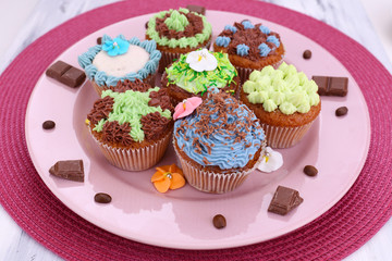Tasty cupcakes with butter cream,
