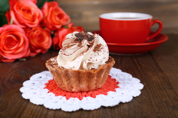 Tasty cake on table on wooden background