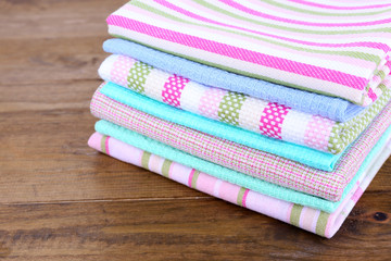 Kitchen towels on wooden background