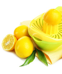 Citrus press and lemons isolated on white