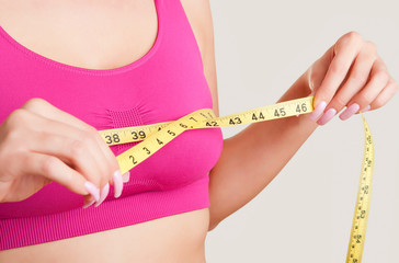 Woman Measuring Up Her Chest