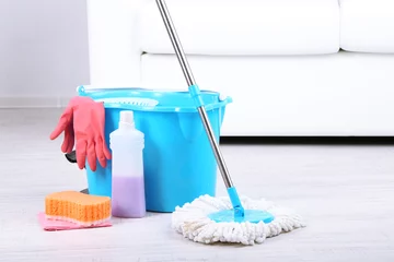 Fotobehang Floor mop and bucket for washing in room © Africa Studio