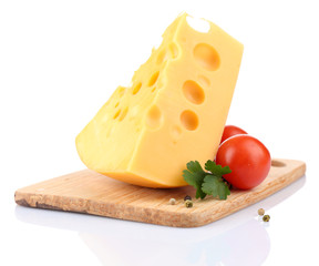 Piece of cheese and tomatoes, on wooden board, isolated on