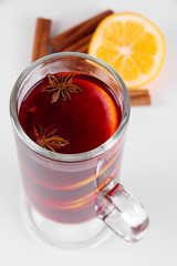 Mulled wine with lemon and spices close up