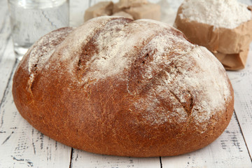 Composition with rye bread on wooden background