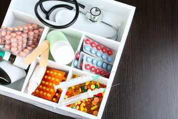 Medical pills,stethoscope,  ampules in wooden box,