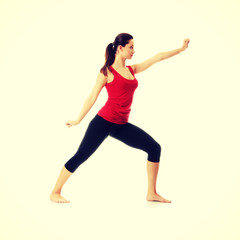 Fototapeta na wymiar Young woman doing yoga exercise
