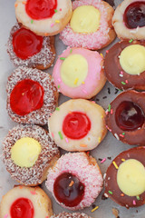close-up of donut and strawberry jam