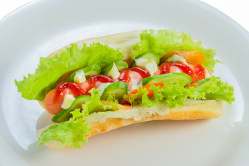 Hot dog and bread isolated on white plate