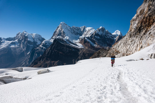 Porter crossing Mera La pass in Everest region, NEPAL.