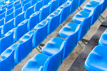 Fototapeta premium Empty dark blue chairs at the football Stadium