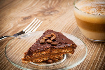 Cup of coffee latte and a cake