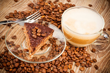 Cup of coffee latte and a cake