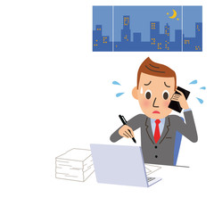 深夜残業する男性サラリーマン