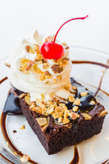Chocolate brownie icecream and cherry