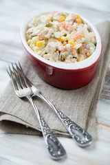 Close-up of russian traditional olivier salad, vertical shot