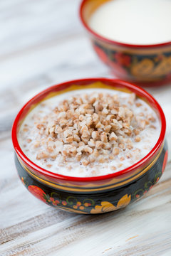 Boiled buckwheat with milk, close-up