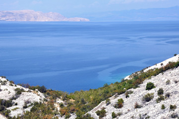 Sea coastline with eroded limestone cliffs