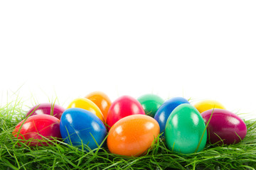easter eggs in busket on green gras isolated
