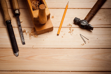 carpenter tools in pine wood table