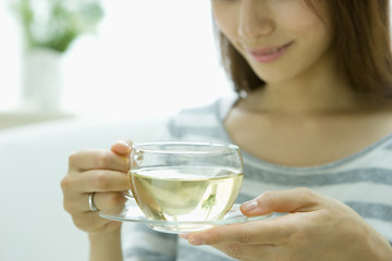 Woman drinking herb tea - obrazy, fototapety, plakaty
