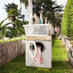 old washing machine in a garden, outdoors
