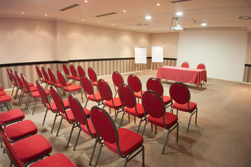 empty conference room with red chairs