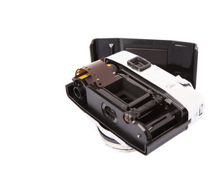 Old retro analog camera with new film roll over white background