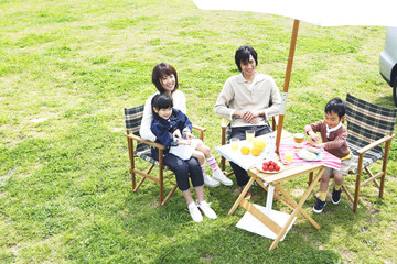 family enjoying picnic in prairie