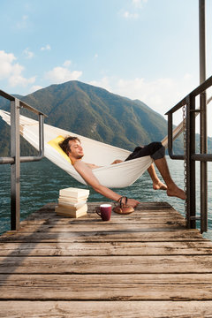 Man Sleeping In A Hammock