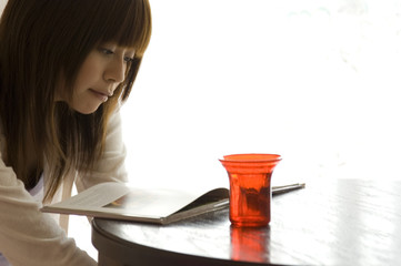 Japanese woman in her twenties reading book
