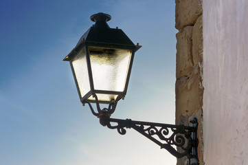 Fototapeta na wymiar lamppost against blue sky