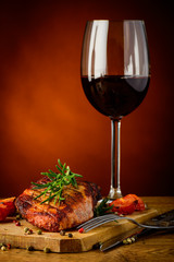 grilled steak and glass of red wine