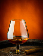 Glass of cognac and cigar