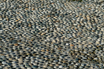 Cobbled street made of small stones and pebbles