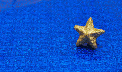 Gold star on  metallic blue background