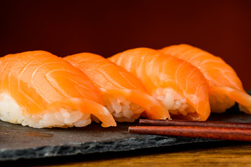 Nigiri sushi with salmon and chopsticks