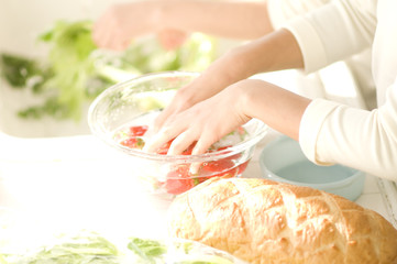 hand of two Japanese girls washing vegetables