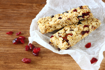 granola bar or energy bar on wooden background