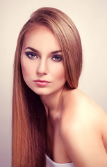 Pretty fashion  female model with long straight glossy hair