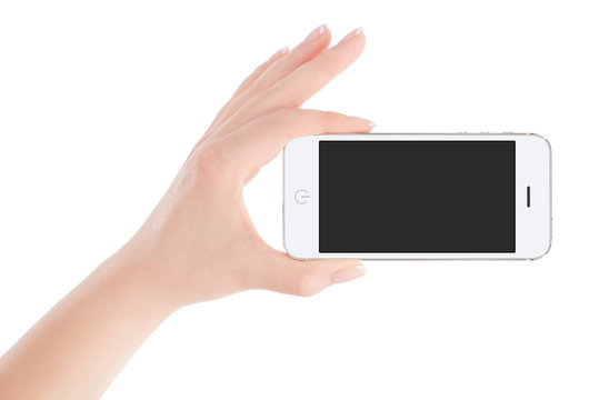 Female hand holding white smartphone in landscape orientation